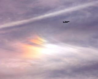 Airliner flying past a sundog